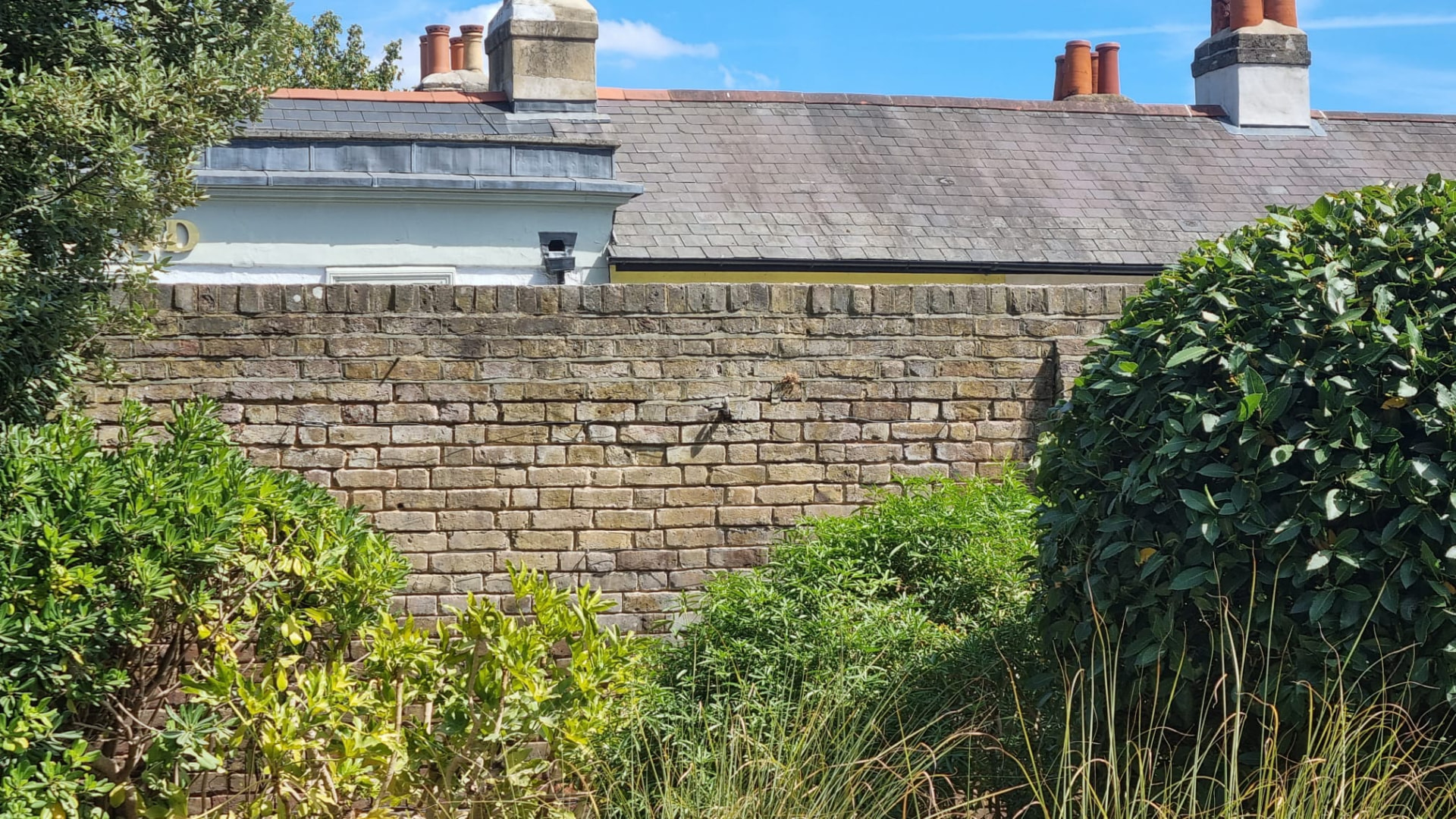 Section of the Hampton wall showing eroded mortar joints before work started