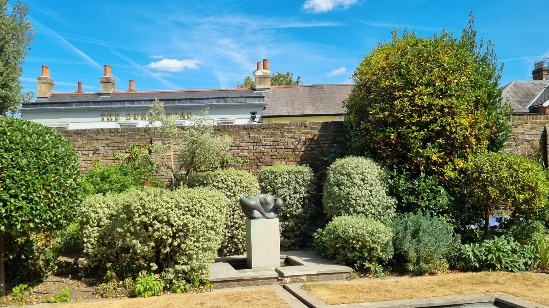 Garden view of the Hampton wall before lime repointing